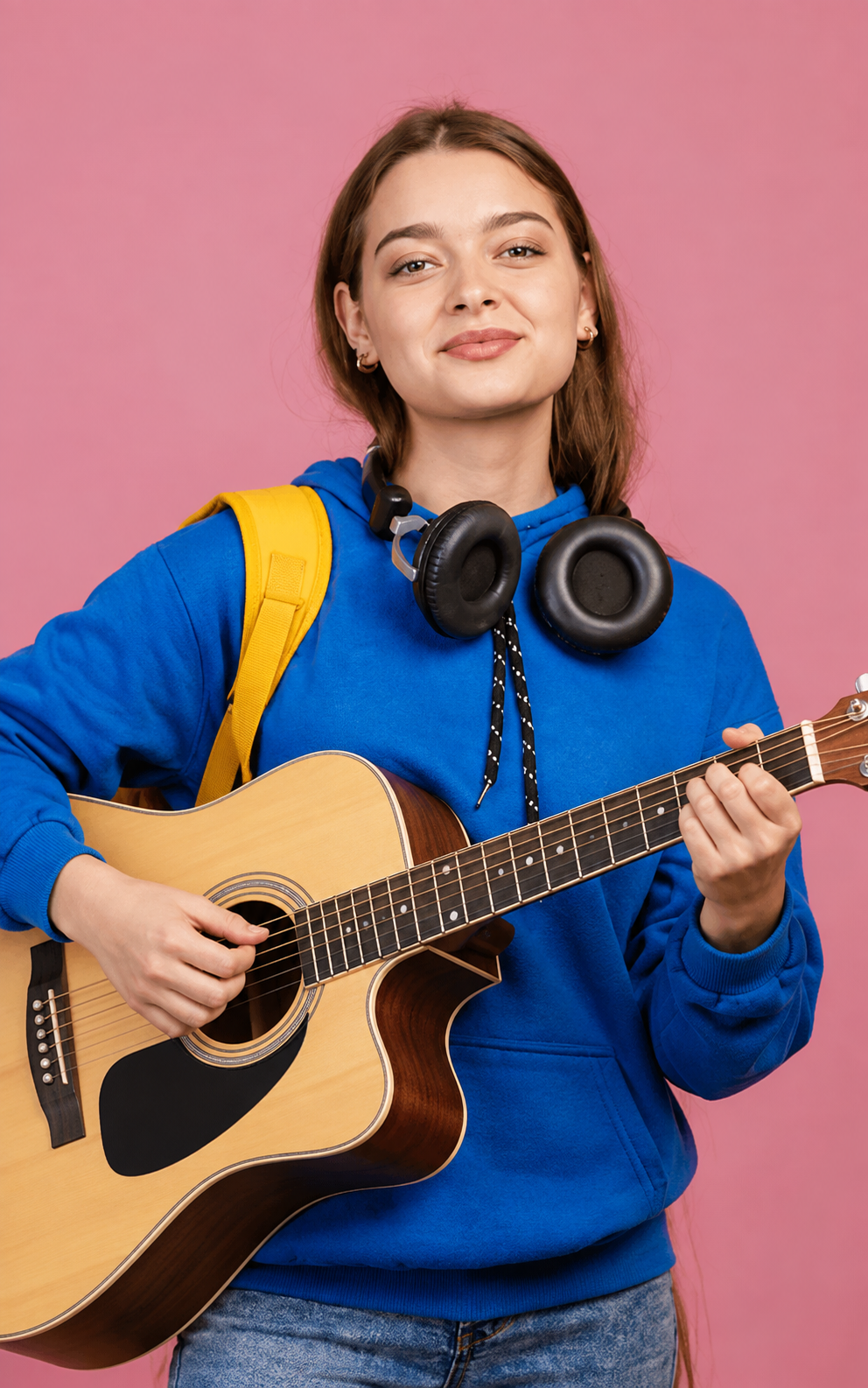 Guitar student enjoying a music lesson