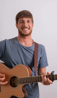Guitarist playing an acoustic guitar
